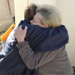 FEMA worker hugs resident at disaster