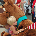 Children hug Scooby Doo